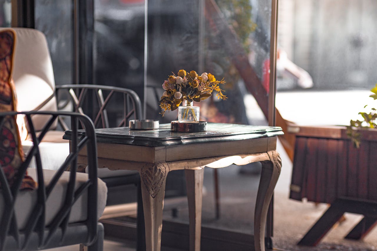 The Art of Drawing Readers In: Your attractive post title goes here Charming indoor setting with a vintage table and floral arrangement, creating a warm and inviting atmosphere.